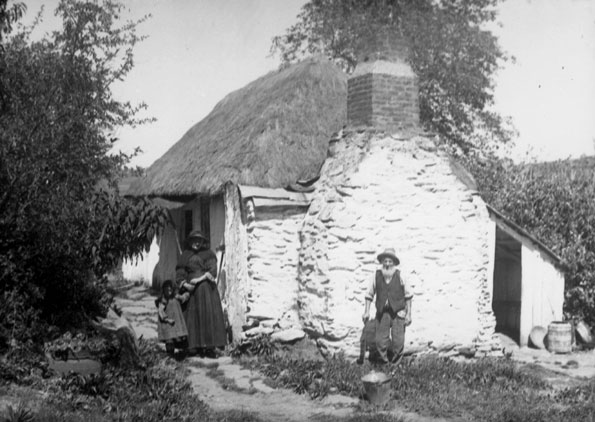 Settlers in front of their cottage, c1890